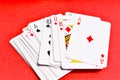 Playing card ACe Heart Jack Queen King on Textured Red Background Royalty Free Stock Photo