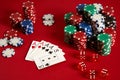 Casino gambling poker equipment and entertainment concept - close up of playing cards and chips at red background. Four Royalty Free Stock Photo