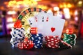 Casino game objects on black table and game room background
