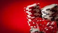 Casino games and gambling concept with stacked poker chips and red dice used in the game of craps. There are two white stacks and Royalty Free Stock Photo