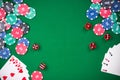 Casino games related items on green table, copy space Royalty Free Stock Photo