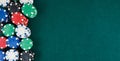 Casino gaming background with stacks of chips on green mat Royalty Free Stock Photo