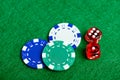 Casino green table with chips and dices