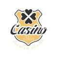 Casino logo premium design, vintage gambling badge or emblem with golden shield and clover leaf vector Illustration Royalty Free Stock Photo