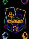 Casino neon sign with glowing dice and cards Royalty Free Stock Photo