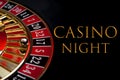 Casino night poster and gambling on games of chance concept with the ball in the winning number seventeen on a roulette wheel