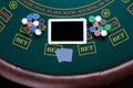 Casino, online gambling, technology and people concept - close up of poker player with playing cards