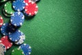 Casino or poker chips on green felt gambling background Royalty Free Stock Photo