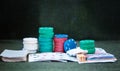 Casino poker chips stack with playing cards, dice and money on green felt background Royalty Free Stock Photo