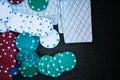 Casino poker chips stack with playing cards, dice and money on green felt background Royalty Free Stock Photo