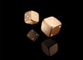 Casino poker dice on black background with reflection. Online casino golden dice gambling concept isolated on black. 3d