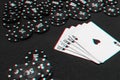 Casino poker gambling and winning combination. Royal flush and a bet of chips on table background Royalty Free Stock Photo