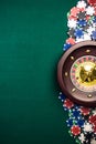 Casino Roulette Background with Roulette Drum,Casino Chips on Green Felt Table