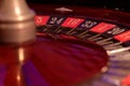 Casino roulette wheel closeup with black and red numbers