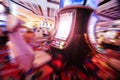 Casino theme out of focus , motion blurred rows of Casino slot machines in a casino with Shallow Depth of Field. Las Vegas Royalty Free Stock Photo