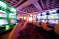 Casino theme out of focus , motion blurred rows of Casino slot machines in a casino with Shallow Depth of Field. Las Vegas Royalty Free Stock Photo