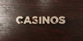 Casinos - grungy wooden headline on Maple - 3D rendered royalty free stock image