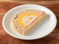 Cassata ice cream served in a white plate over a rustic wooden table, selective focus