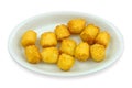 Cassava manioc fried dumpling on a plate, on white background, clipping path included.