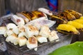 Cassava and roasted banana on the grille for sale in market Royalty Free Stock Photo