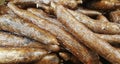 Cassava vegetable roots on a market stand.