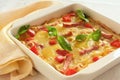 Casserole with cheese, bacon and tomatoes