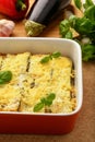 Casserole with chicken, eggplant, zucchini and tomatoes.