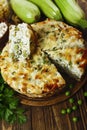 Casserole of pasta with green peas, zucchini and curd Royalty Free Stock Photo