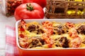 Casserole with vegetables, meatballs and cheese.