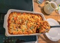 Casserole ziti pasta with with meat, peas, herbs and cheese close-up on a plate. horizontal Royalty Free Stock Photo