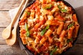 Casserole ziti pasta with minced meat, tomatoes, herbs and cheese close-up. Horizontal top view Royalty Free Stock Photo