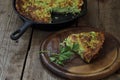 Casserole with zucchini , a piece of quiche with zucchini and he Royalty Free Stock Photo