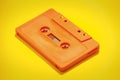 Cassette tape obsolete st orange on yellow Royalty Free Stock Photo