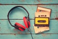 Cassette tapes over blue textured wooden table . top view. retro filter