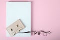 Cassette and white sheet of paper Royalty Free Stock Photo