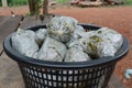 Cassia leaves that have been boiled and packaged into a bag and placed in a basket on the table.