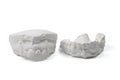 Cast gypsum model plaster for dental molar teeth before braces in laboratory isolated on white background.