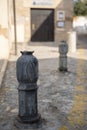 Cast iron black parking bollards in the form of pomegranates on street of Granada, Andalusia, Spain Royalty Free Stock Photo