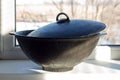 Cast iron cauldron on the windowsill Royalty Free Stock Photo