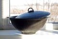 Cast iron cauldron on the windowsill Royalty Free Stock Photo