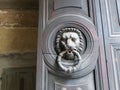 Lion shaped doorknocker with ring in its mouth