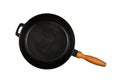 Cast iron frying pan with wooden handle isolated Royalty Free Stock Photo