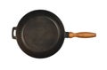 Cast iron frying pan with wooden handle isolated Royalty Free Stock Photo