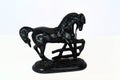 Cast-iron horse figurine isolate on a white background close-up