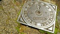 Cast iron manhole cover with Italian writing HYDRAULIC SERVICE, and SPQR of the municipality of Rome