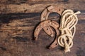 Cast iron metal horseshoes and rope Royalty Free Stock Photo