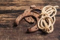 Cast iron metal horseshoes and rope Royalty Free Stock Photo