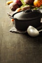 Cast iron pot and vegetables Royalty Free Stock Photo