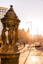 Cast iron public fountain with caryatid female figures in Barcelona