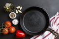 Cast Iron Skillet with copy area on black background with ingredients Royalty Free Stock Photo